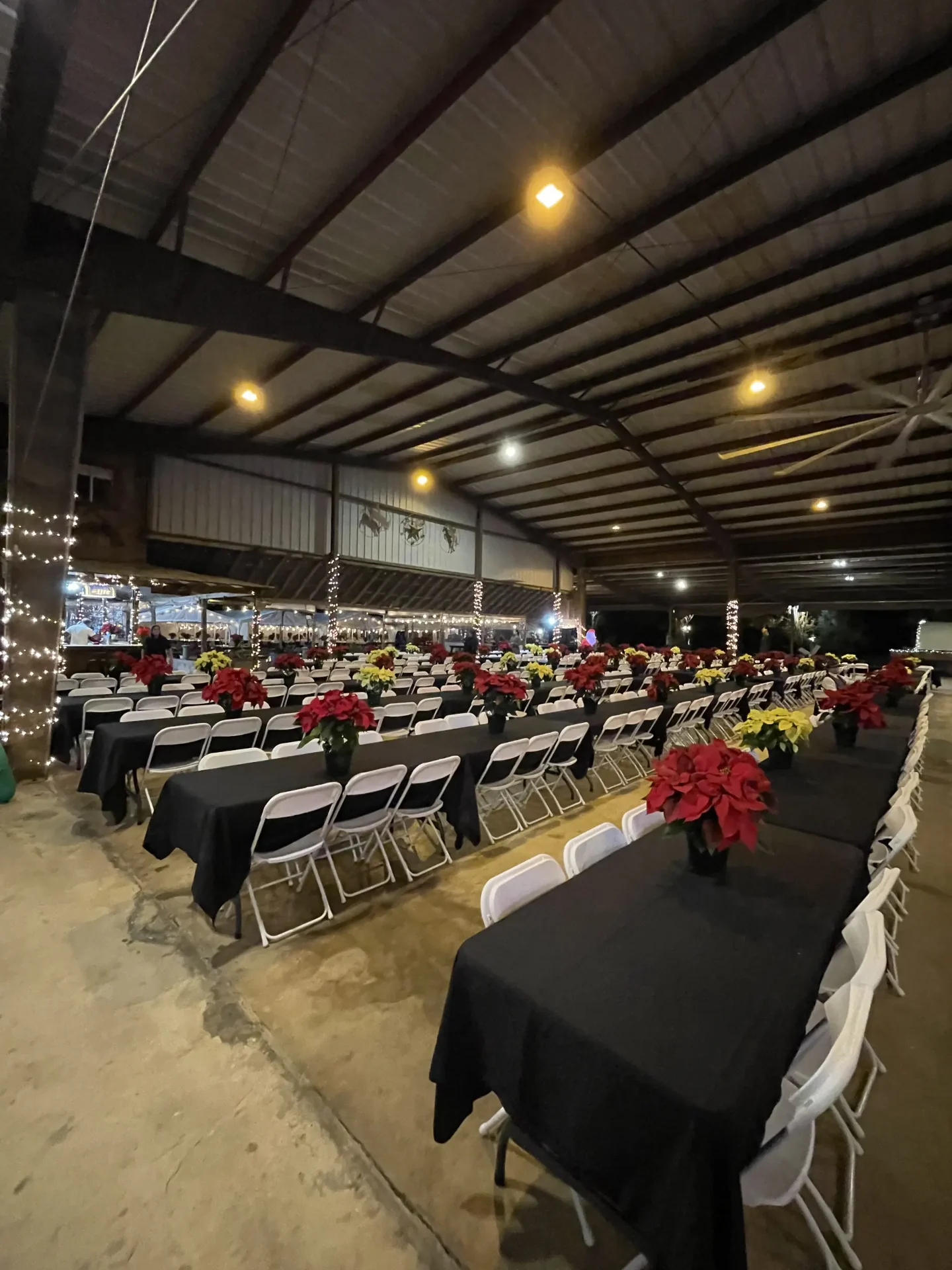 Decorated tables inside the Corral for a corporate holiday dinner near San Antonio