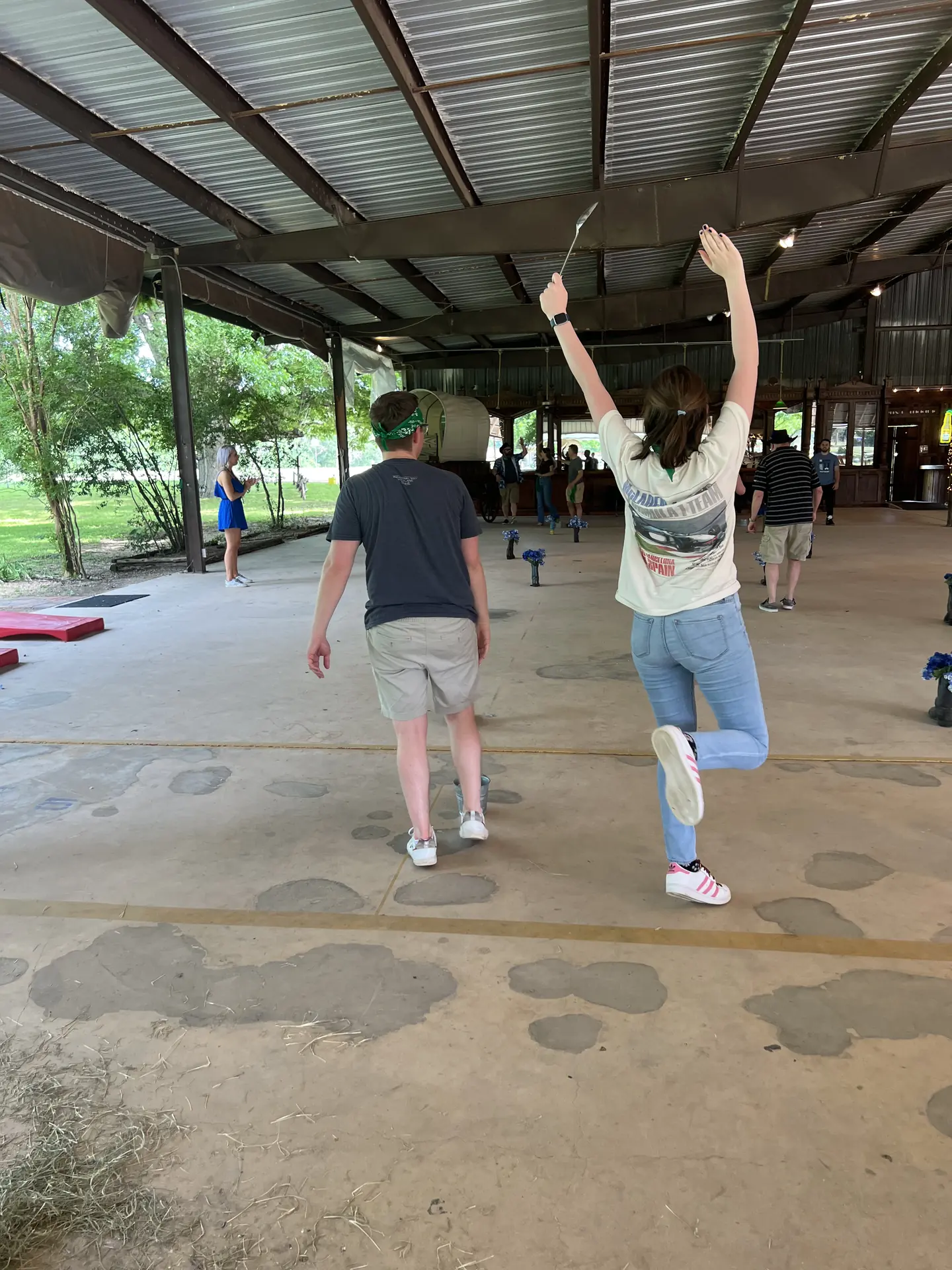 Employees line dancing inside the Corral pavilion at a company picnic near San Antonio