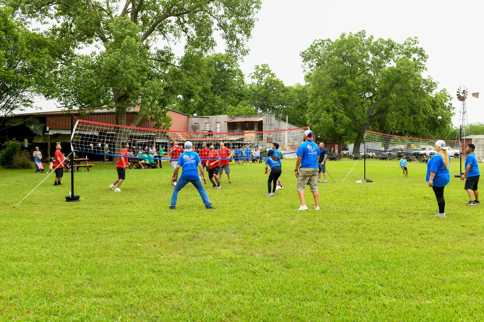 Multi-generational volleyball game during a family reunion at Rio Cibolo Ranch
