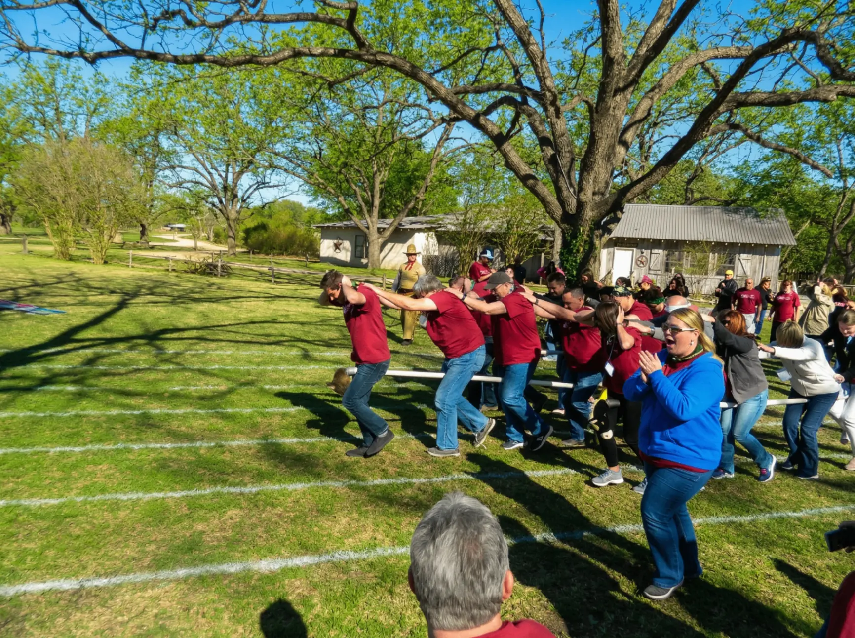Team building tug of war challenge at outdoor corporate retreat venue near San Antonio
