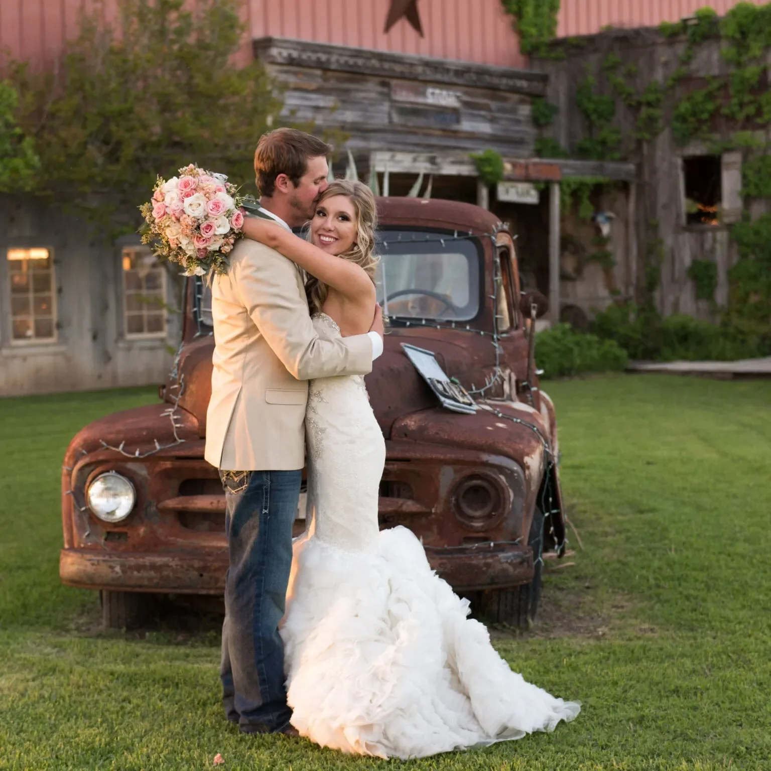 Texas ranch wedding couple in front of vintage truck at outdoor venue near San Antonio